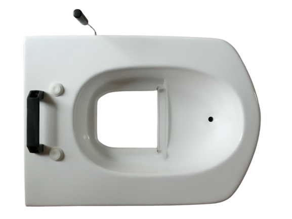 大小分離の便器です。中央の開口部から便がコンテナに落ちます。尿は前側の穴から専用タンクに貯まります。